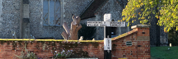 Village sign showing Dereham