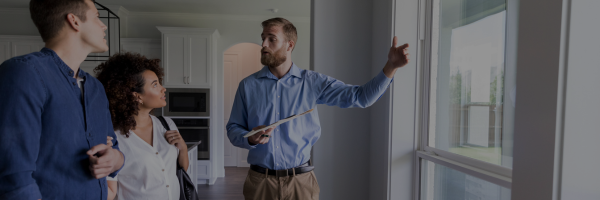 Home buyers looking at house